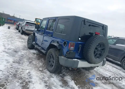2009 Jeep Wrangler Unlimited Sahara z USA, uszkodzony, nr VIN 1J4GA59129L712696